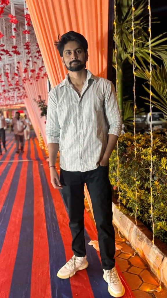 Amar Karthik standing on a carpet